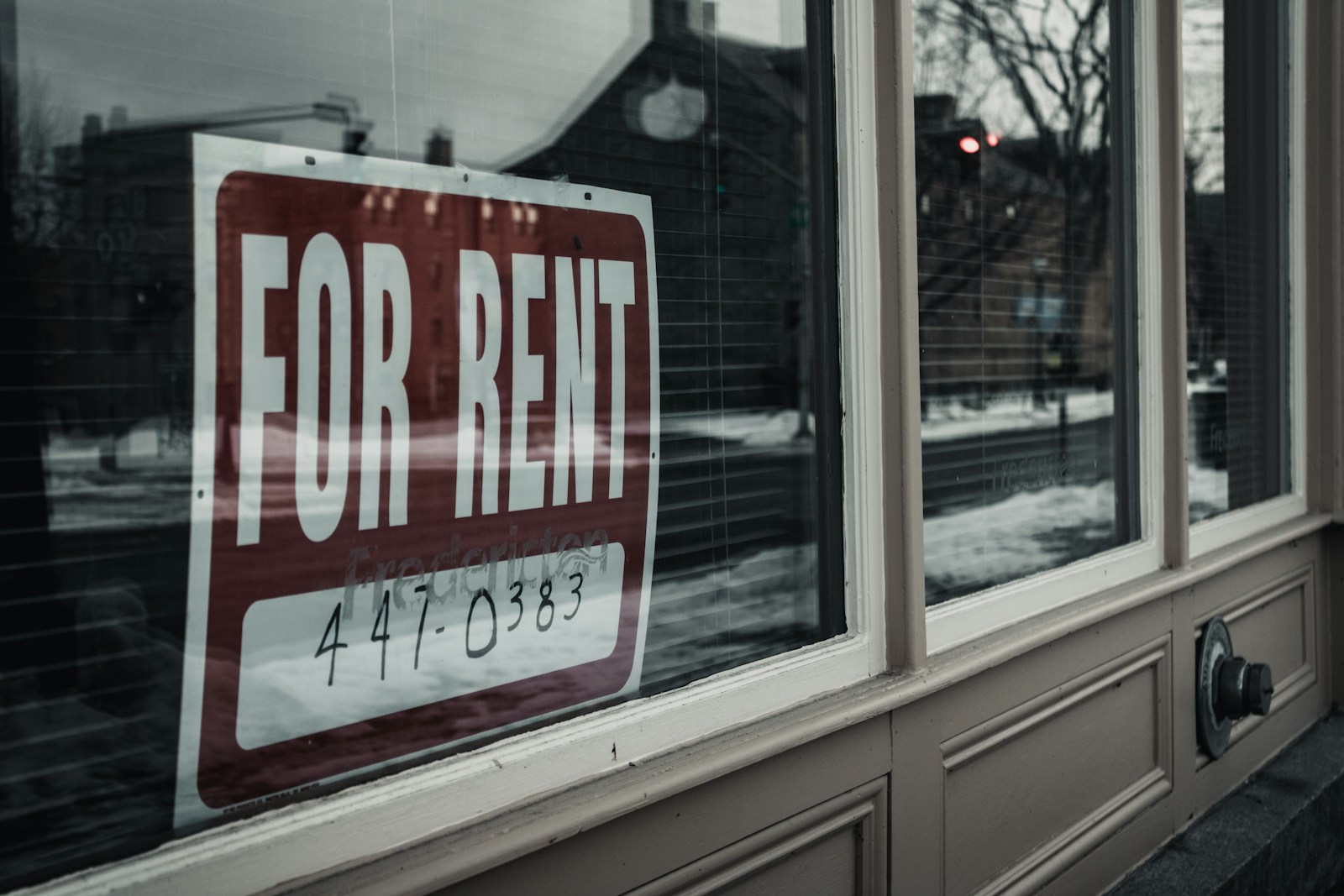 white wooden framed glass window, rental property